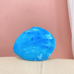 Unique blue pebble-shaped acrylic clutch bag with marble stone texture and shell design