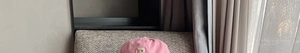 Detailed shot of a pink cotton baseball cap featuring a white embroidered letter P logo