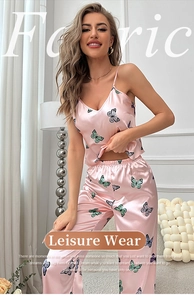 Close-up of pink silk satin pajama set with delicate butterfly prints and V-neck detail