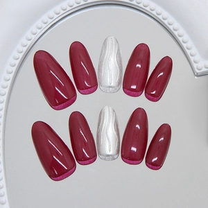 Deep burgundy glossy press-on nails with silver wavy 3D textured accent nail set
