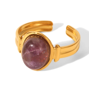 Detail of 18k gold plated open ring featuring an oval purple natural stone inlay