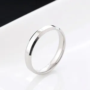 Detailed side view of a 4mm polished stainless steel ring with beveled edges