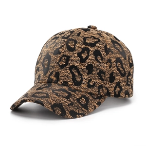 Detail shot of the textured leopard print fabric on a stylish six-panel baseball cap