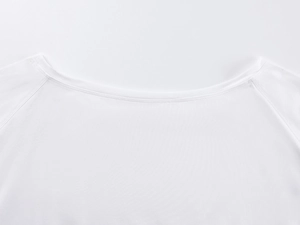 Macro detail of high-quality white cotton fabric stitching on the neckline and shoulder