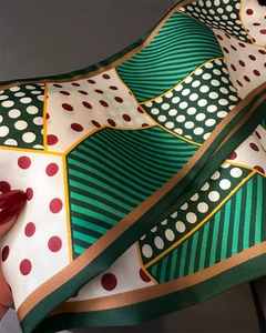 Close-up of retro double-layer silk scarf with green stripes and colorful polka dots