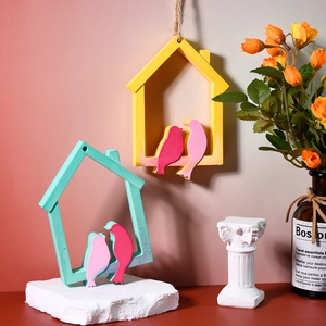 Detail of bird nest frames with small bird figurines for home decoration and resin DIY