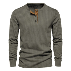 Close-up of olive green corduroy Henley shirt with contrast brown button placket detail