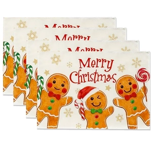 Set of 4 Christmas gingerbread man linen placemats with festive candy cane and snowflake patterns