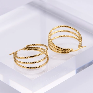 Chic triple-layered gold twisted rope hoop earrings made of polished stainless steel