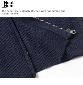 Detail of ribbed knit hem and silver metal zipper on a navy blue business jacket