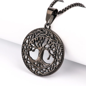 Detailed macro view of a vintage gunmetal Celtic knot Tree of Life pendant necklace