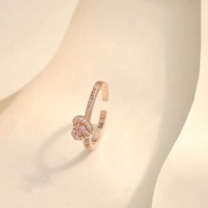 Macro shot of rose gold heart ring with pink zircon and micro-pave crystals detail