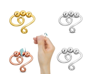 Detail view of spinning anti-anxiety beads on twist band rings in various metallic finishes