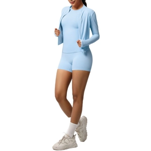 Three-piece light blue sports set with zip-up jacket, short sleeve top and gym shorts