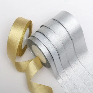 Detail of metallic gold and silver glitter ribbons showing textures and reflective weave