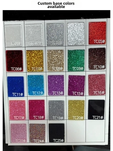 Macro shot of glitter acrylic color swatches showing twenty-three vibrant texture options