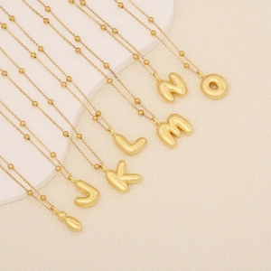 Golden balloon style initial letter necklace with polished bead chain for women