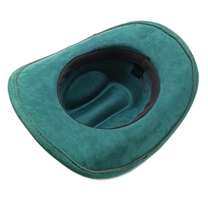 Top view of dark green faux suede cowboy hat showing inner sweatband and product label