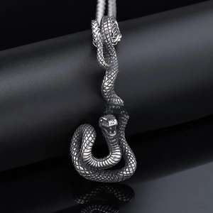 Macro shot of realistic snake pendant featuring detailed silver scales and texture