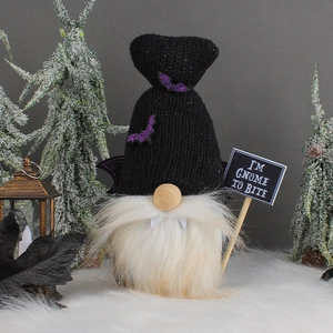 Halloween gnome plush with black pointed hat and I'M GNOME TO BITE sign on white fur