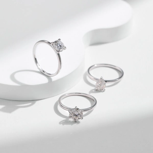 Three Moissanite S925 silver rings with round princess and pear-cut solitaire stones