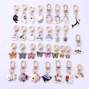 Detail view of assorted colorful metal alloy animal keychains with gold clasps