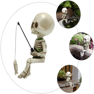 Detailed resin fishing skeleton statue with green moss texture and small fish accessory