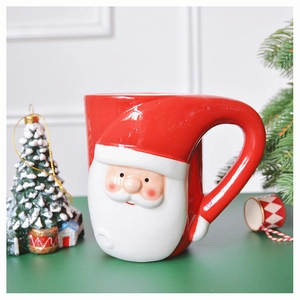 Close-up of 3D Santa Claus relief on ceramic Christmas mug with sturdy curved handle