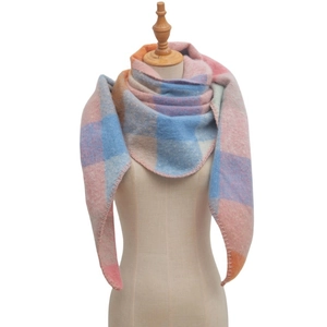 Detail of soft colorful plaid mohair triangle scarf with delicate overlock stitched edges
