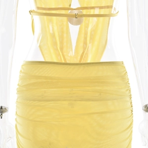 Detail of yellow cowl neck halter top and draped bodycon skirt in sheer mesh fabric