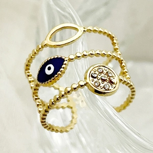 Gold multi-layer open ring featuring blue evil eye and crystal disk with beaded bands