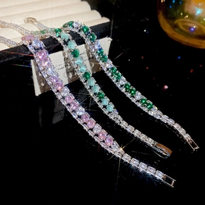 Detailed macro view of three colored zircon bracelets with sparkling pavé crystal settings