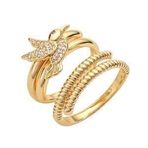Golden hummingbird ring set with sparkling zircons and spiral textured bands