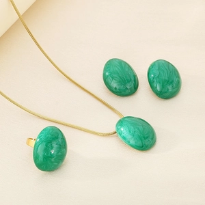 Detailed set of gold titanium steel jewelry featuring green marble texture oval enamel