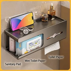 Wall-mounted dark grey metal bathroom tissue box with top shelf and triple compartments