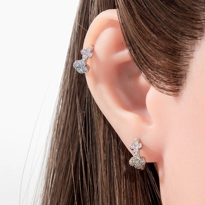 French vintage silver flower earrings with micro-inlaid zircons shown on a model