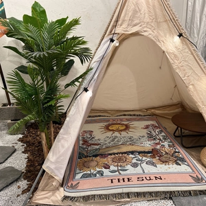 Detail of The Sun tarot woven blanket with tassels for outdoor camping and home decor