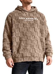 Detailed close-up of brown sherpa hoodie with checkered texture and Los Angeles embroidery