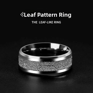 Macro shot of silver stainless steel ring featuring frosted leaf-like texture details