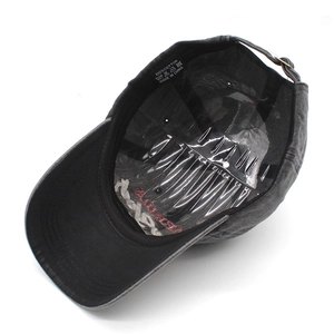 Detail of internal lining and 100% cotton wash label on the dark gray baseball cap