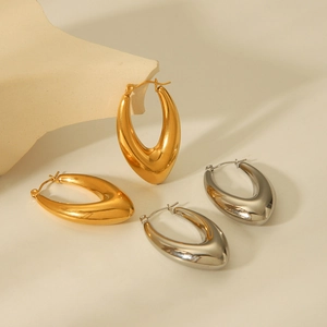 Polished gold and silver geometric teardrop earrings in a minimalist design