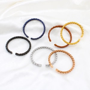 Set of 6 colorful woven mesh stainless steel open bangles on white silk background