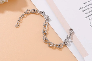 Detail of silver S-link chain bracelet with lobster clasp and adjustable extender