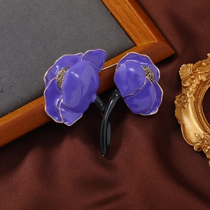 Artistic purple enamel peony brooch with gold edges and vintage luxury display background