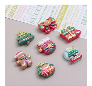 Macro view of Christmas Gingerbread Man resin charms with colorful pearlescent finish