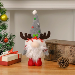 Standing Christmas gnome with reindeer antlers on rustic wooden surface with festive background