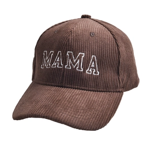 Detail of premium brown corduroy baseball cap featuring white MAMA embroidery text