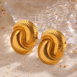 Chic 18K gold plated stainless steel shell earrings with radiating texture in a beach setting