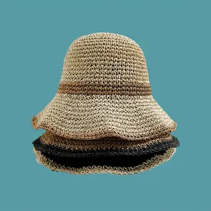 Breathable hand-woven straw sun hat for women featuring fine crochet texture and wide brim