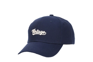 Detail of white vintage cursive embroidery on a navy blue twill cotton baseball cap